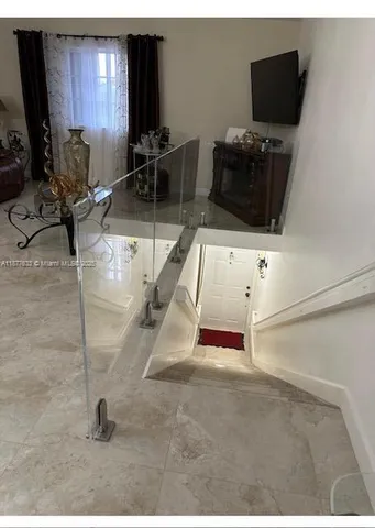 a room with lots of chairs and mirrors