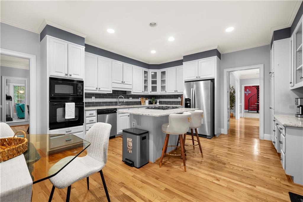 1696 Harts Run Atlanta, GA 30341 - Photo 20 of 55 a kitchen with stainless steel appliances granite countertop a refrigerator a stove top oven and a sink