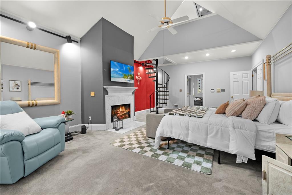 1696 Harts Run Atlanta, GA 30341 - Photo 28 of 55 a bed room with furniture and a fireplace
