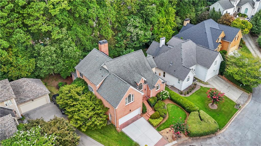 1696 Harts Run Atlanta, GA 30341 - Photo 4 of 55 an aerial view of a house with a garden and trees