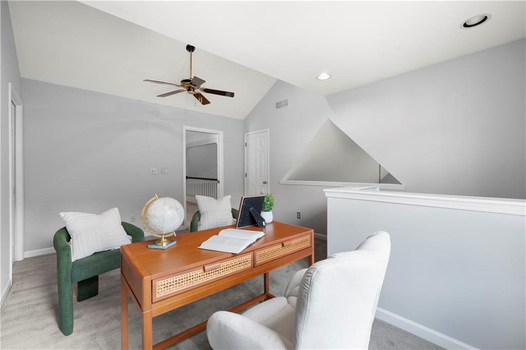 1696 Harts Run Atlanta, GA 30341 - Photo 46 of 55 a living room with furniture a chandelier and a table