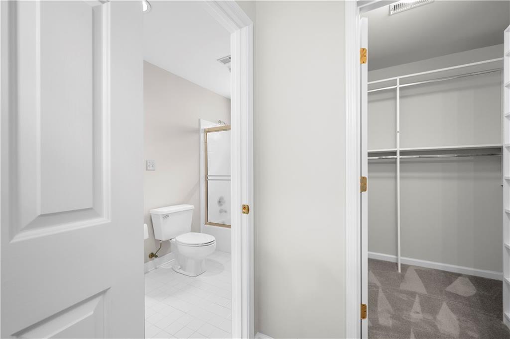 1696 Harts Run Atlanta, GA 30341 - Photo 49 of 55 a bathroom with a shower and a toilet