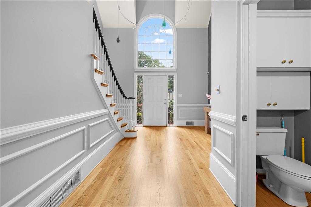 1696 Harts Run Atlanta, GA 30341 - Photo 9 of 55 a view of a hallway with wooden floor and staircase