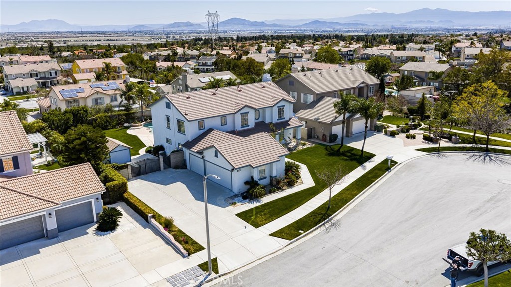 5105 Sanchez Court Rancho Cucamonga, CA 91739 - Photo 1 of 61 an aerial view of a house with a garden and lake view