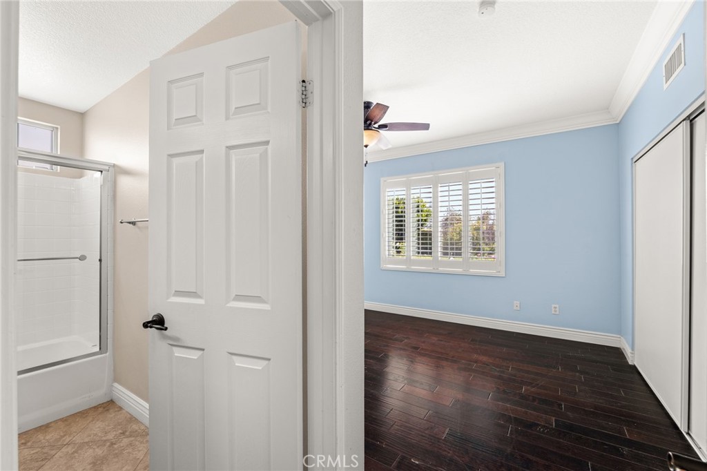 5105 Sanchez Court Rancho Cucamonga, CA 91739 - Photo 19 of 61 a view of an empty room with wooden floor and a window