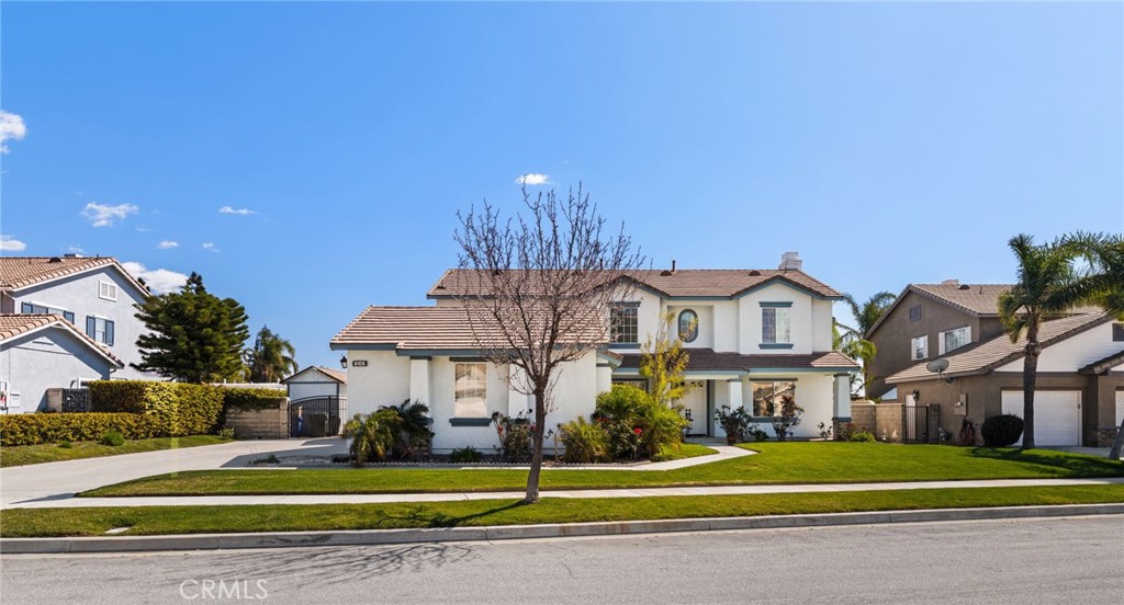 5105 Sanchez Court Rancho Cucamonga, CA 91739 - Photo 2 of 61 a view of a big house with a big yard and large trees