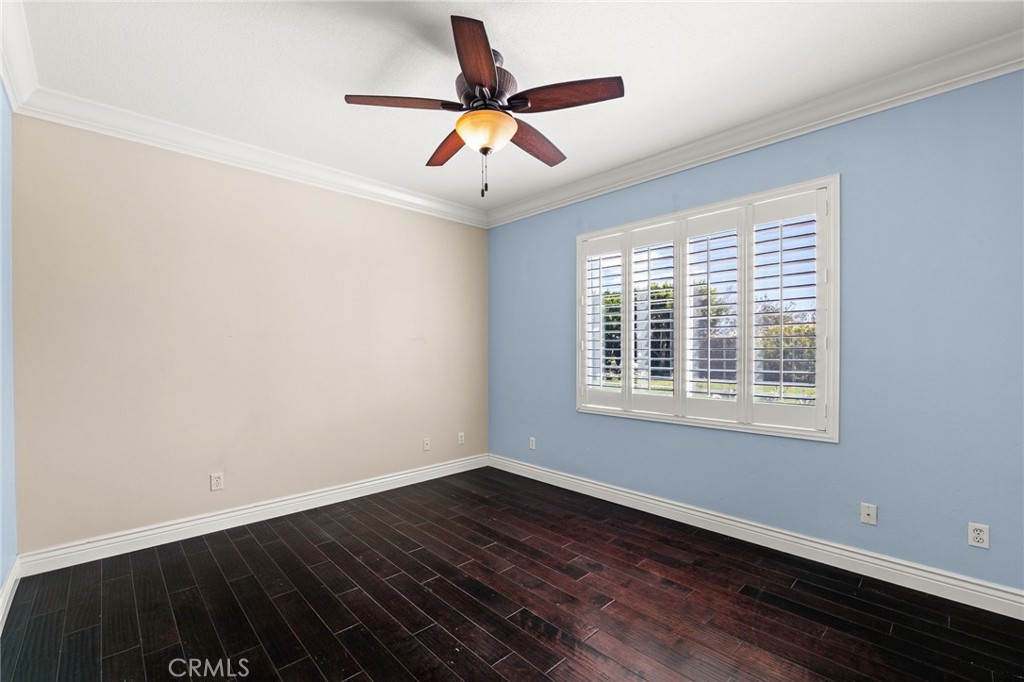 5105 Sanchez Court Rancho Cucamonga, CA 91739 - Photo 23 of 61 a view of an empty room with wooden floor and a window