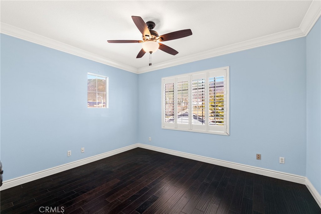 5105 Sanchez Court Rancho Cucamonga, CA 91739 - Photo 25 of 61 a view of a livingroom with a ceiling fan and wooden floor