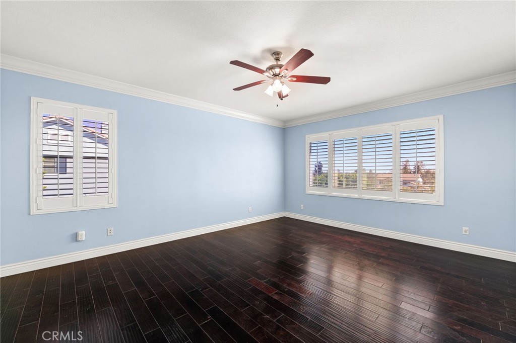 5105 Sanchez Court Rancho Cucamonga, CA 91739 - Photo 28 of 61 a view of an empty room with wooden floor and a window