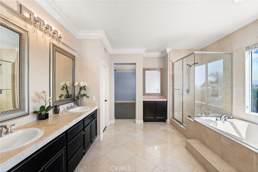 5105 Sanchez Court Rancho Cucamonga, CA 91739 - Photo 30 of 61 a large bathroom with a tub double sink and mirror