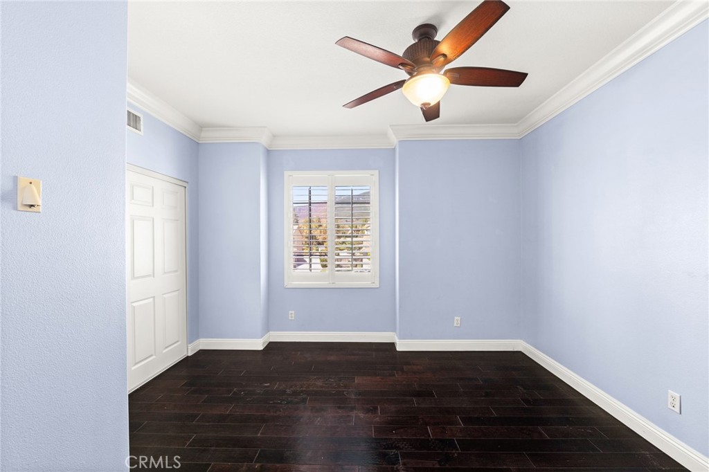 5105 Sanchez Court Rancho Cucamonga, CA 91739 - Photo 33 of 61 an empty room with wooden floor and windows