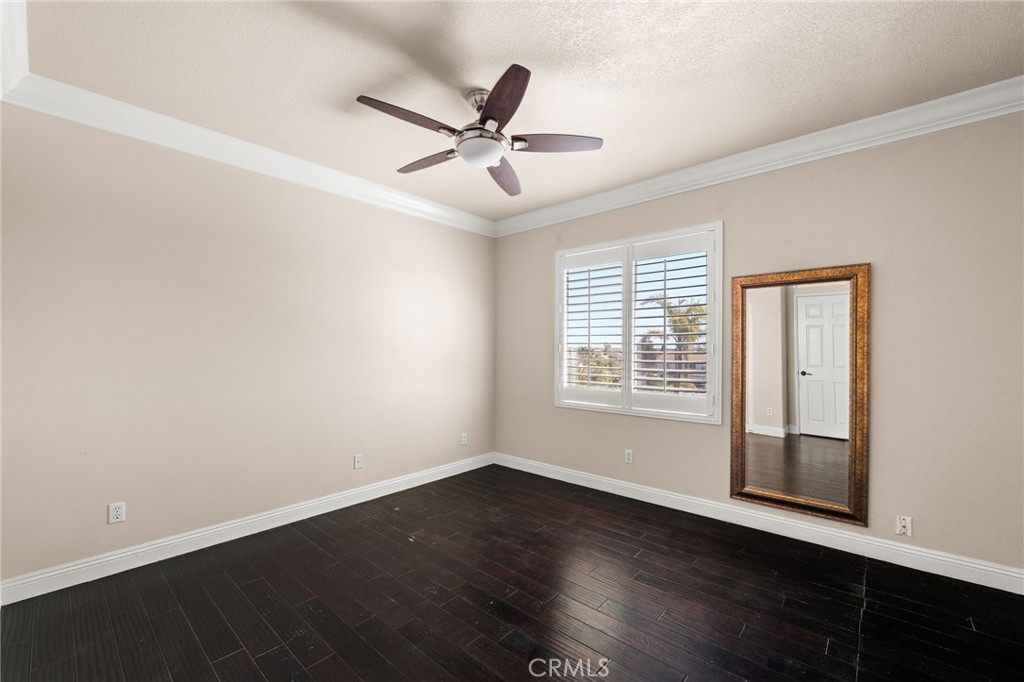 5105 Sanchez Court Rancho Cucamonga, CA 91739 - Photo 41 of 61 a view of an empty room with wooden floor and a window