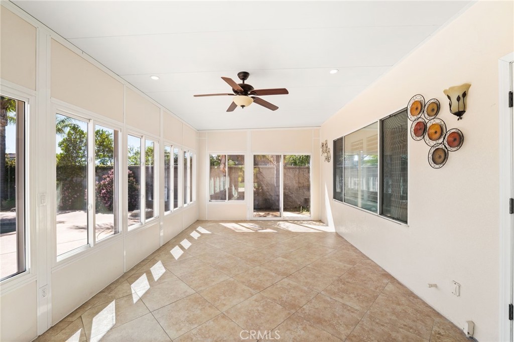 5105 Sanchez Court Rancho Cucamonga, CA 91739 - Photo 44 of 61 a view of a hall with wooden floor and a ceiling fan
