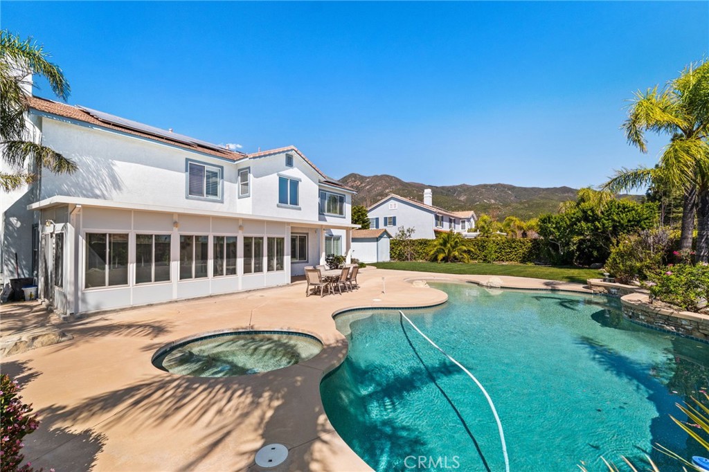 5105 Sanchez Court Rancho Cucamonga, CA 91739 - Photo 47 of 61 a view of a house with swimming pool and porch