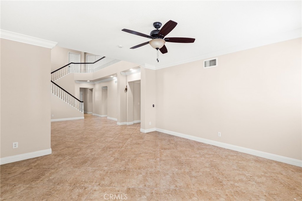 5105 Sanchez Court Rancho Cucamonga, CA 91739 - Photo 6 of 61 a view of empty room with wooden floor and ceiling fan