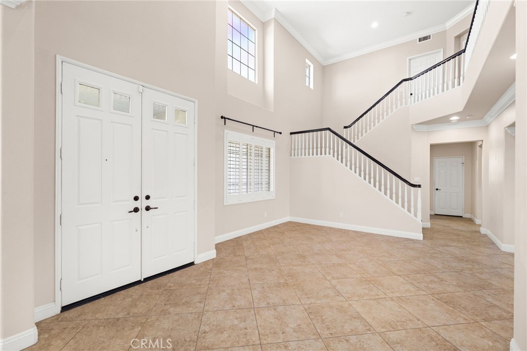 5105 Sanchez Court Rancho Cucamonga, CA 91739 - Photo 7 of 61 a view of an entryway with white walls and windows