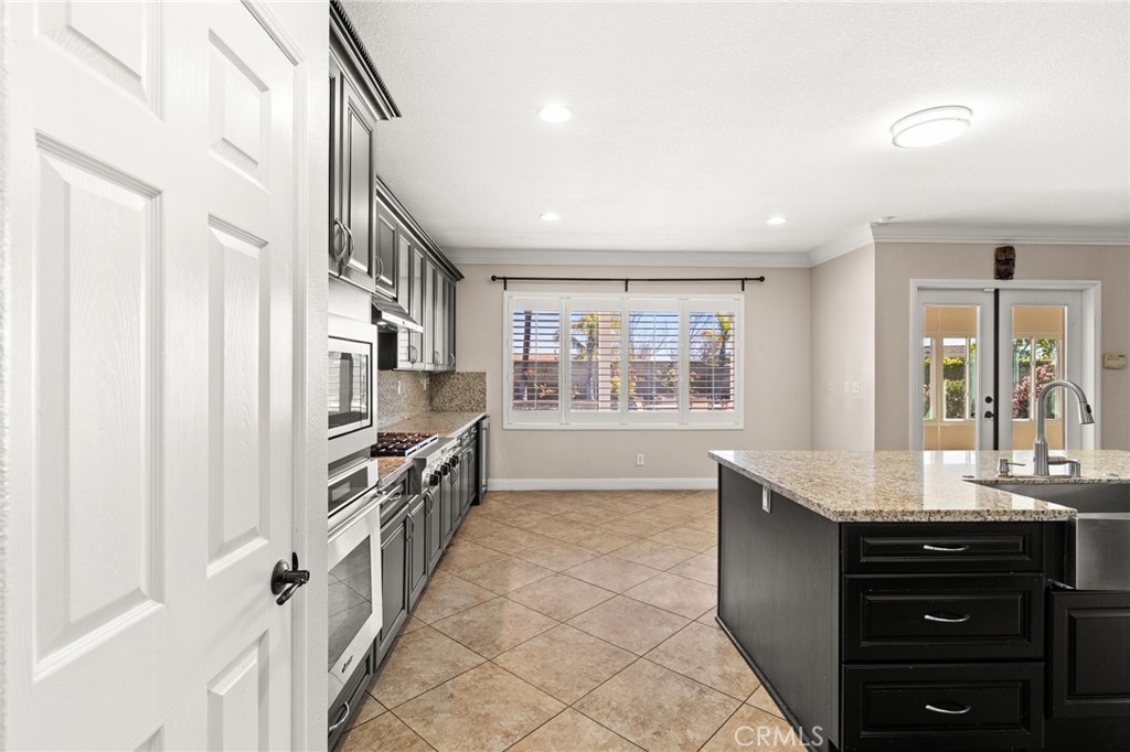 5105 Sanchez Court Rancho Cucamonga, CA 91739 - Photo 10 of 61 a kitchen with granite countertop a stove and a sink