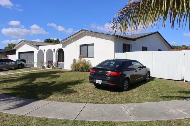 a car parked in front of a house
