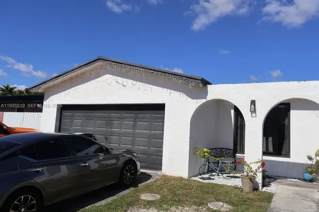 a front view of a house with outdoor space