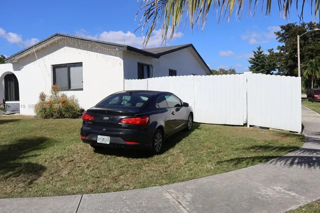 a view of a house with a back yard