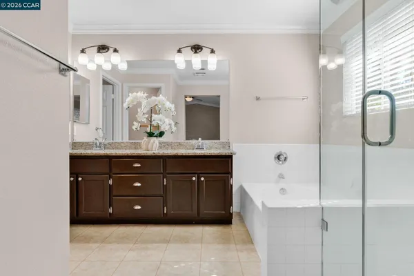 a bathroom with a sink toilet a mirror and shower