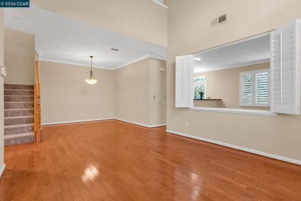 a view of a dining room with furniture window and wooden floor