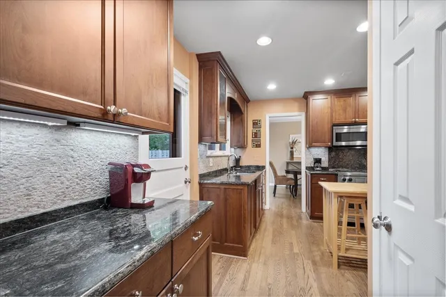a kitchen with lots of counter top space and stainless steel appliances