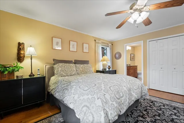 a spacious bathroom with a double vanity sink a mirror and a shower