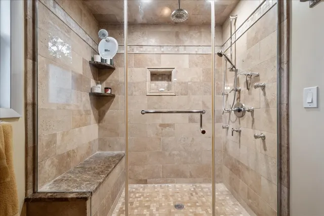 a balcony with wooden floor and trees in the back