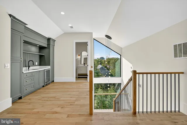 a view of a kitchen with a sink dryer and washer