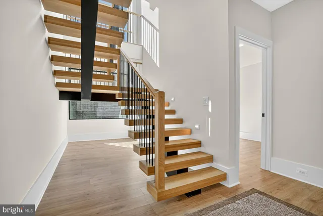 a kitchen with granite countertop a sink cabinets and a window