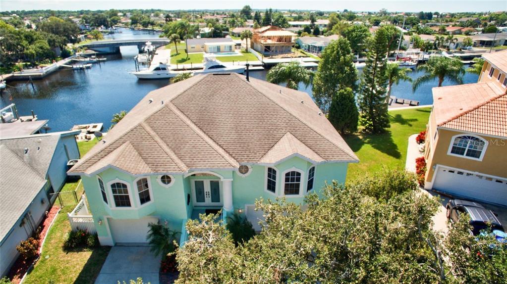 4348 Reeves Road New Port Richey, FL 34652 - Photo 1 of 1 Stunning elevated - vaulted ceiling waterfront property.