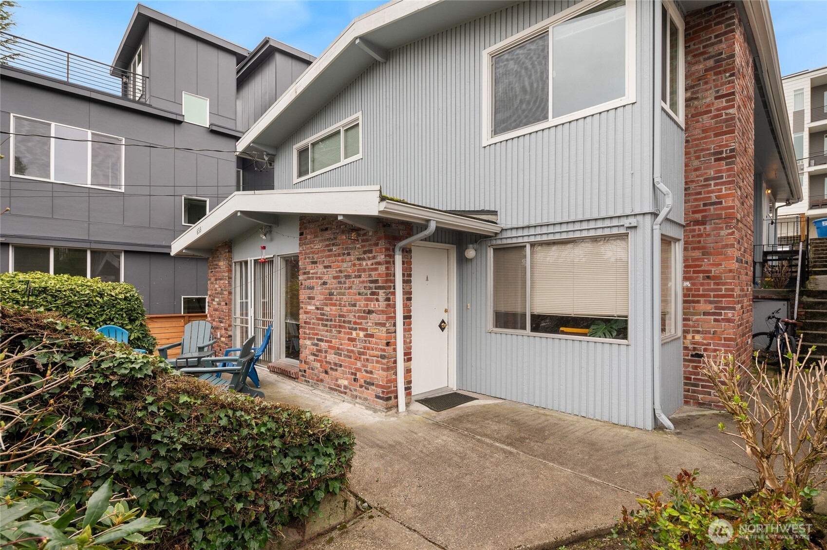 633 West Emerson Street Seattle, WA 98119 - Photo 1 of 25 a front view of a house with garage