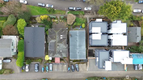 an aerial view of houses with outdoor space