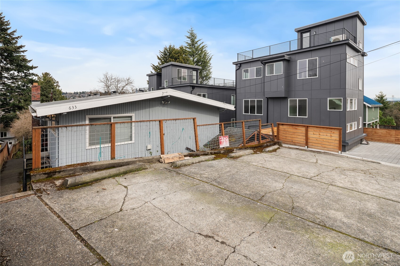 633 West Emerson Street Seattle, WA 98119 - Photo 3 of 25 a view of a house with a yard and large tree