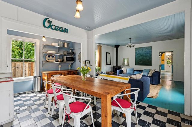 a view of a bedroom with furniture and window