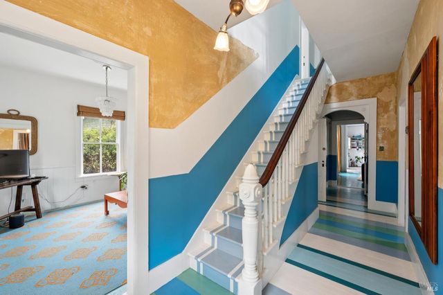 a view of living room with furniture and a dresser