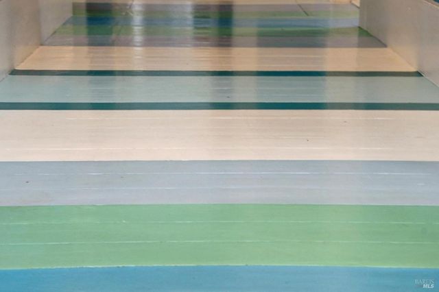 a bedroom with two beds and a table