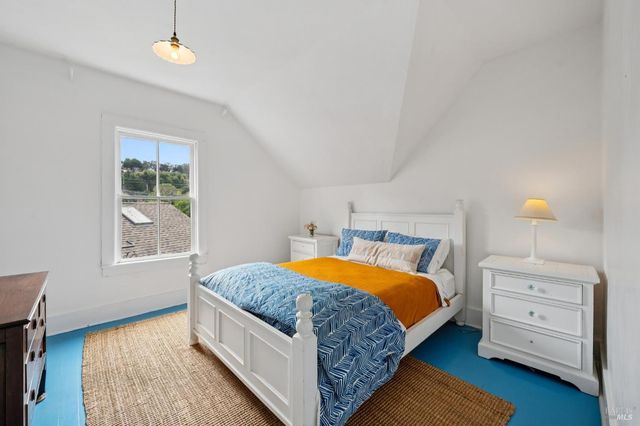 a view of a patio with table and chairs and potted plants