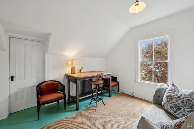 a view of a chairs and table in the patio