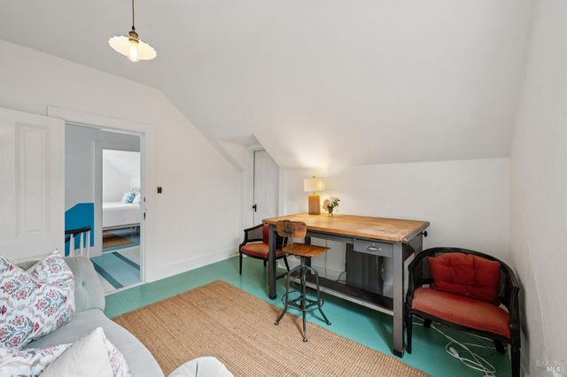 a view of a patio with couches table and chairs and potted plants