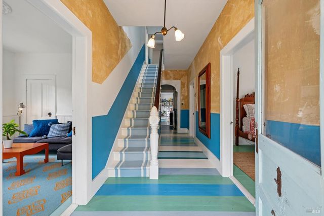 a view of a dining room with furniture window and outside view
