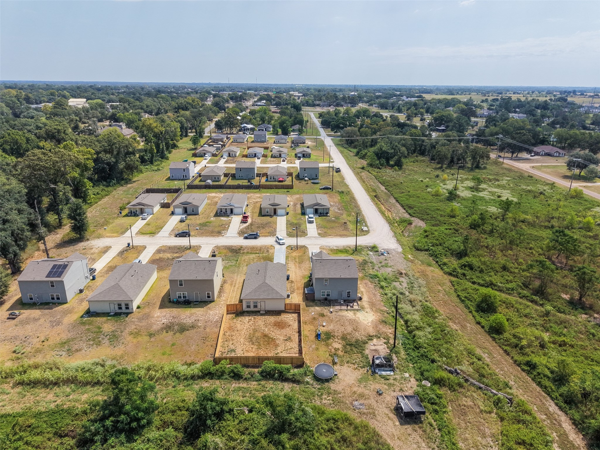 2537 18th Street Hempstead, TX 77445 - Photo 24 of 28 Wide aerial view showcasing the surrounding residential development, neighborhood layout, and nearby open acreage