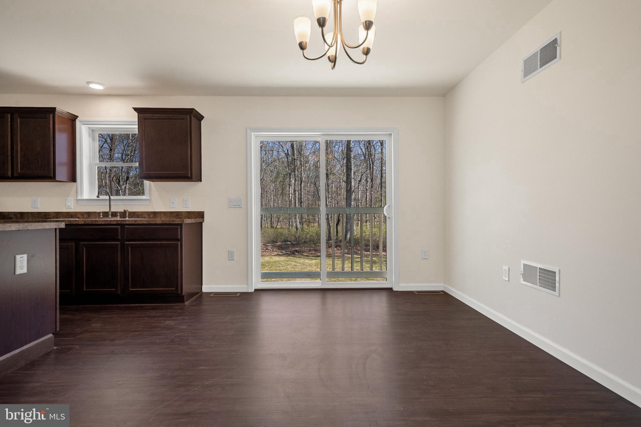 666 Irving Avenue Bridgeton, NJ 08302 - Photo 13 of 41 a kitchen with stainless steel appliances granite countertop a stove a sink and a microwave