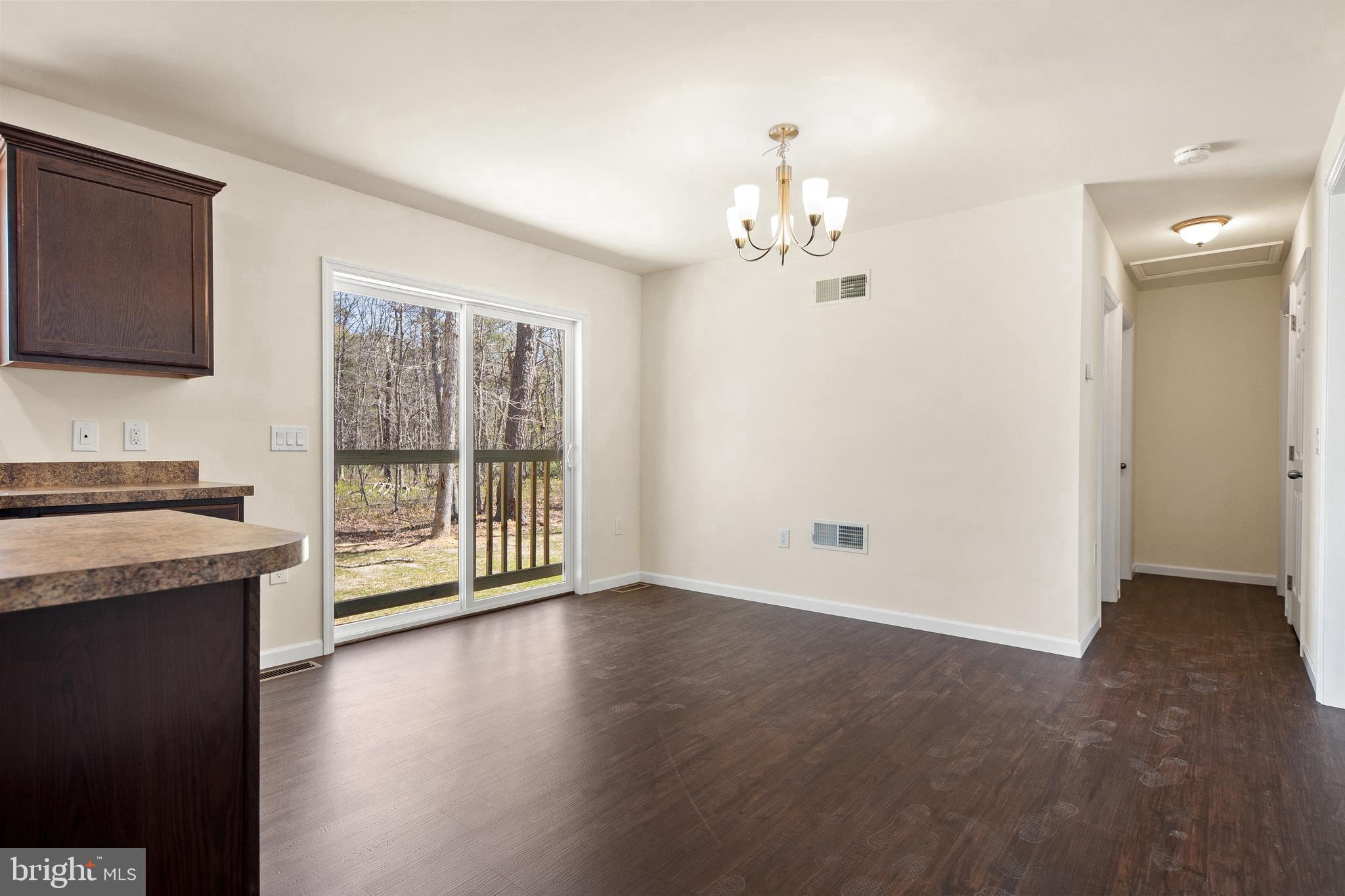 666 Irving Avenue Bridgeton, NJ 08302 - Photo 14 of 41 a view of an empty room with a kitchen