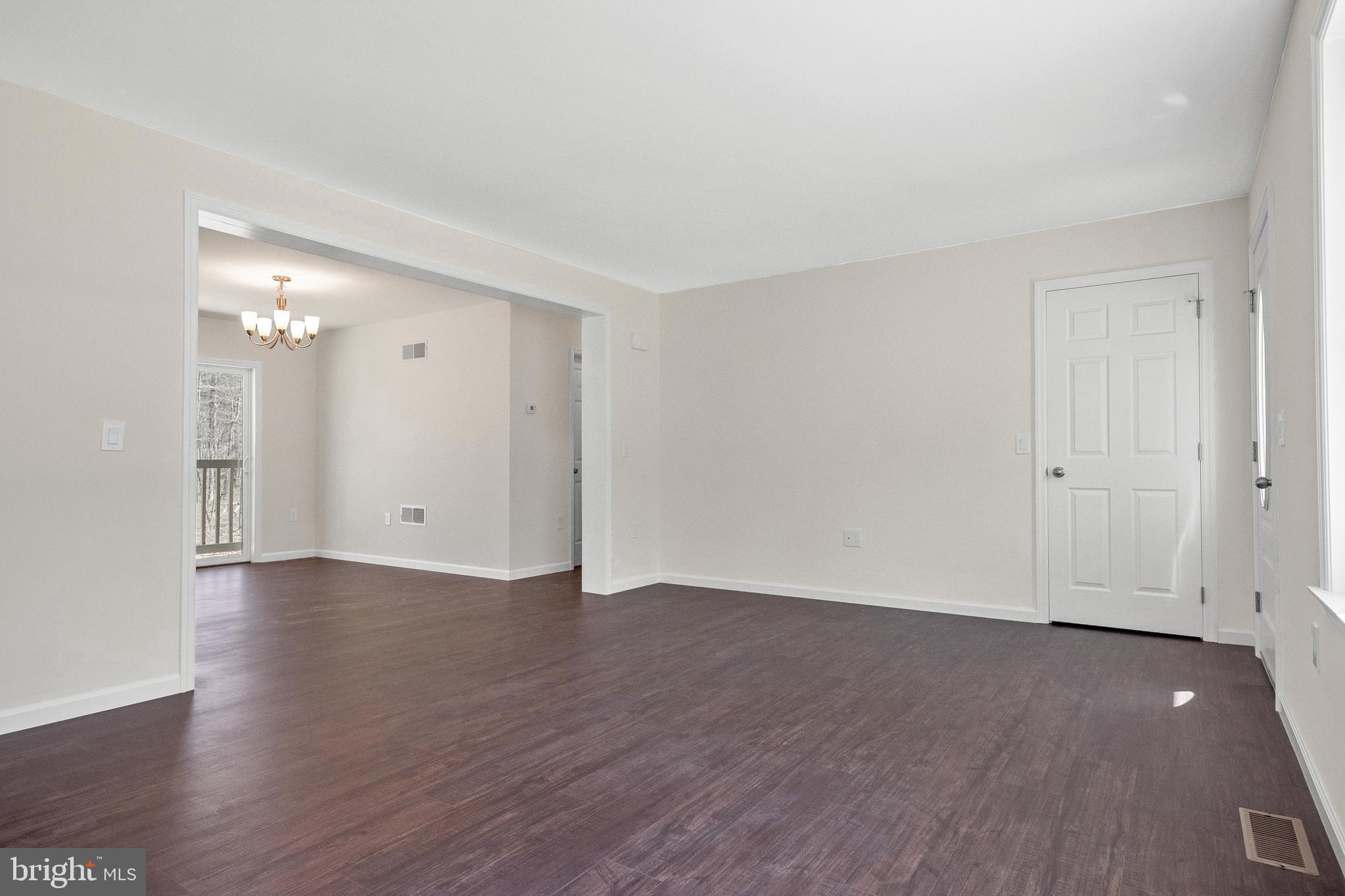 666 Irving Avenue Bridgeton, NJ 08302 - Photo 16 of 41 a view of an empty room with wooden floor and closet