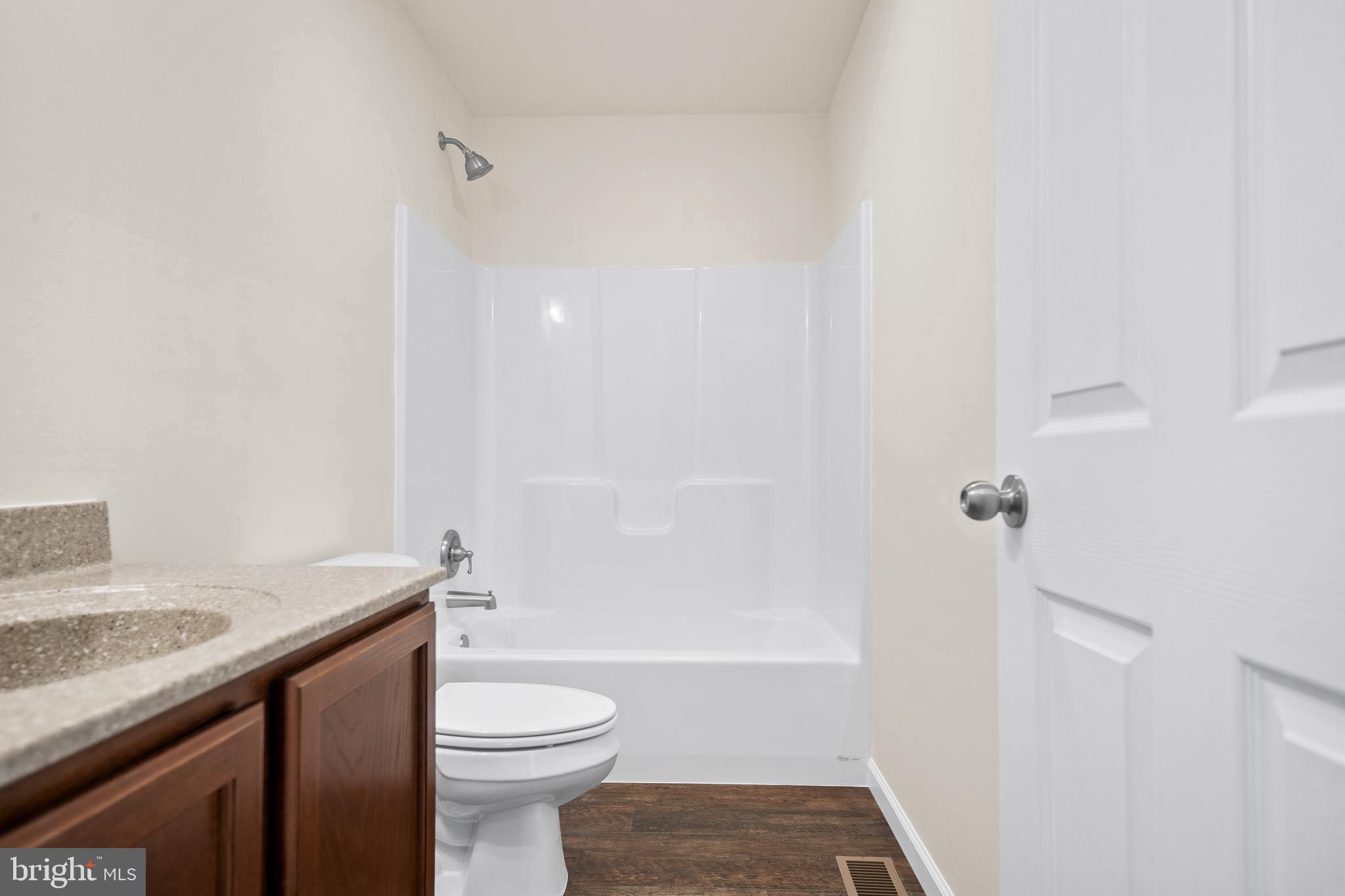 666 Irving Avenue Bridgeton, NJ 08302 - Photo 29 of 41 a bathroom with a sink a toilet and shower