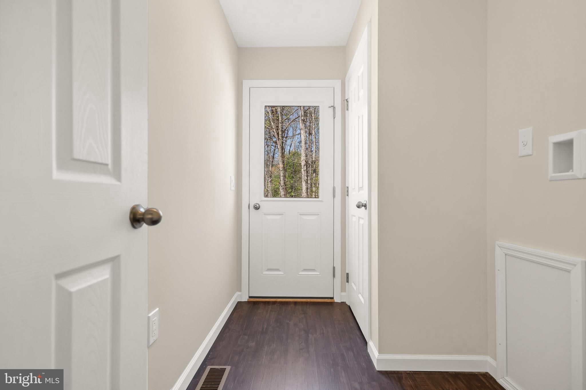 666 Irving Avenue Bridgeton, NJ 08302 - Photo 4 of 41 a view of a hallway with wooden floor