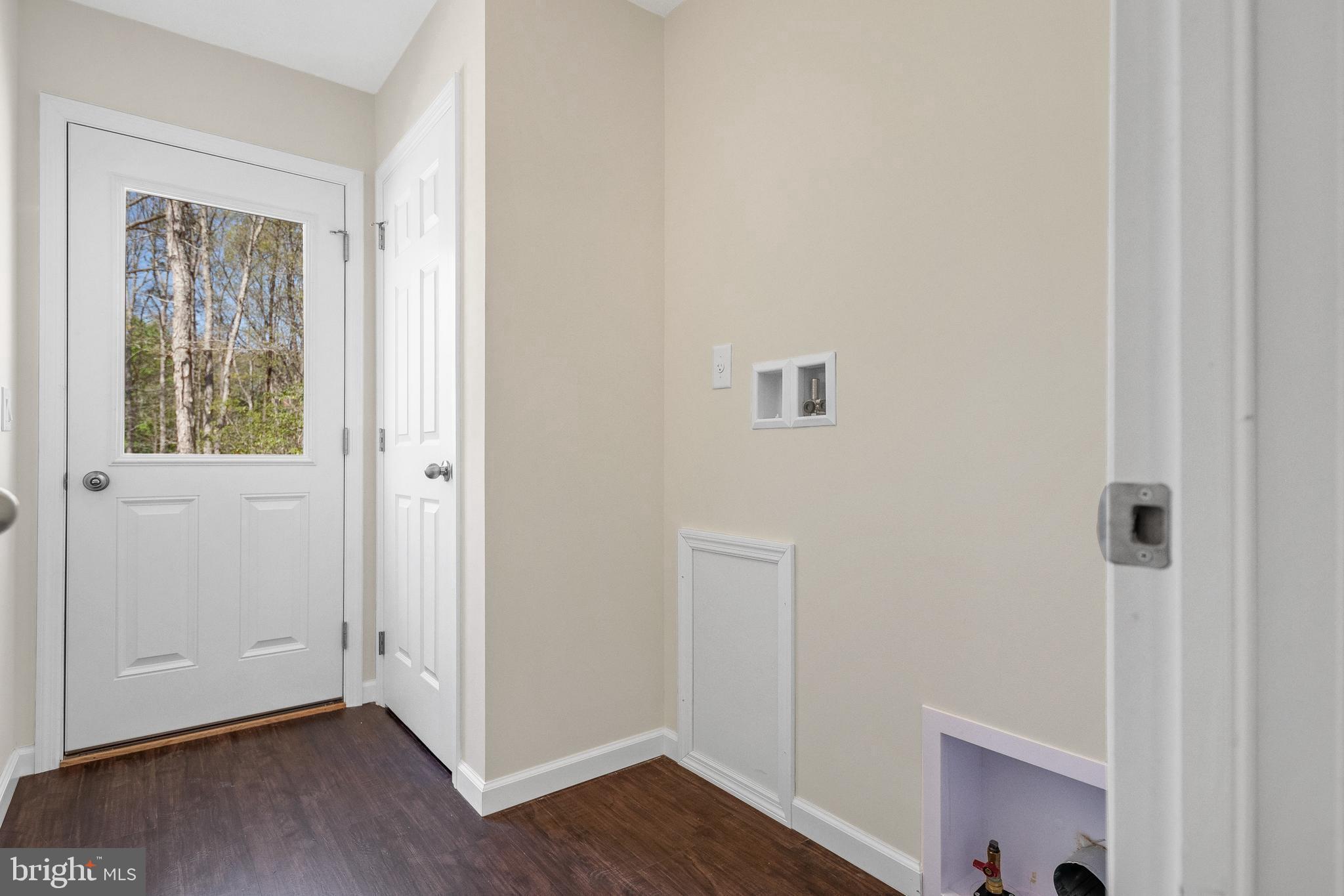 666 Irving Avenue Bridgeton, NJ 08302 - Photo 5 of 41 a view of an empty room with wooden floor and a window