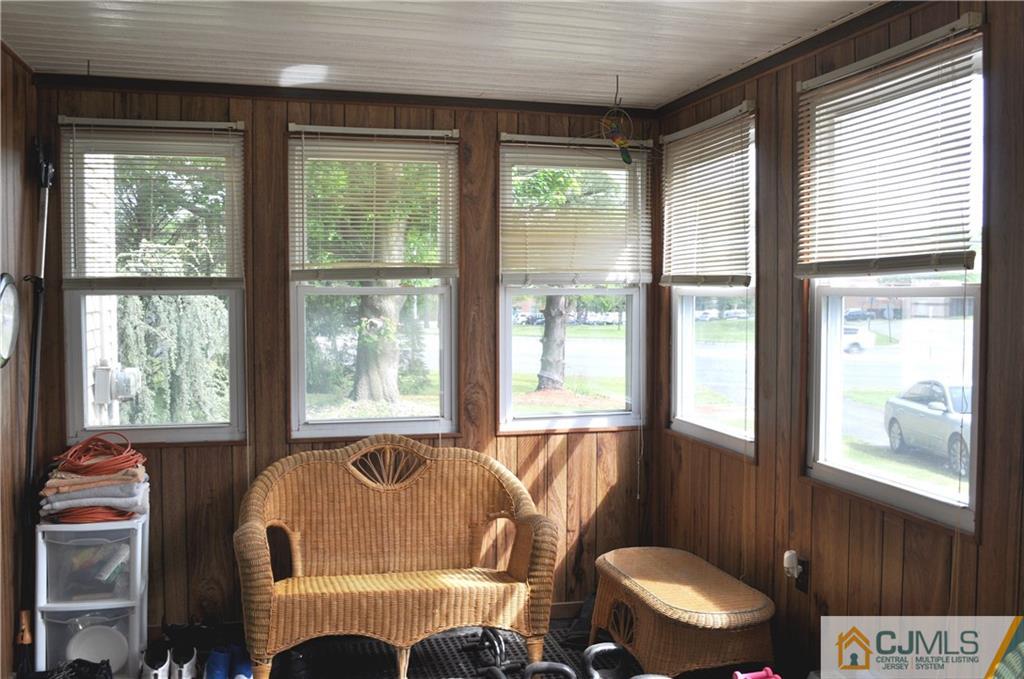 547 Ridge Road Monmouth Junction, NJ 08852 - Photo 14 of 25 a living room with furniture and a window